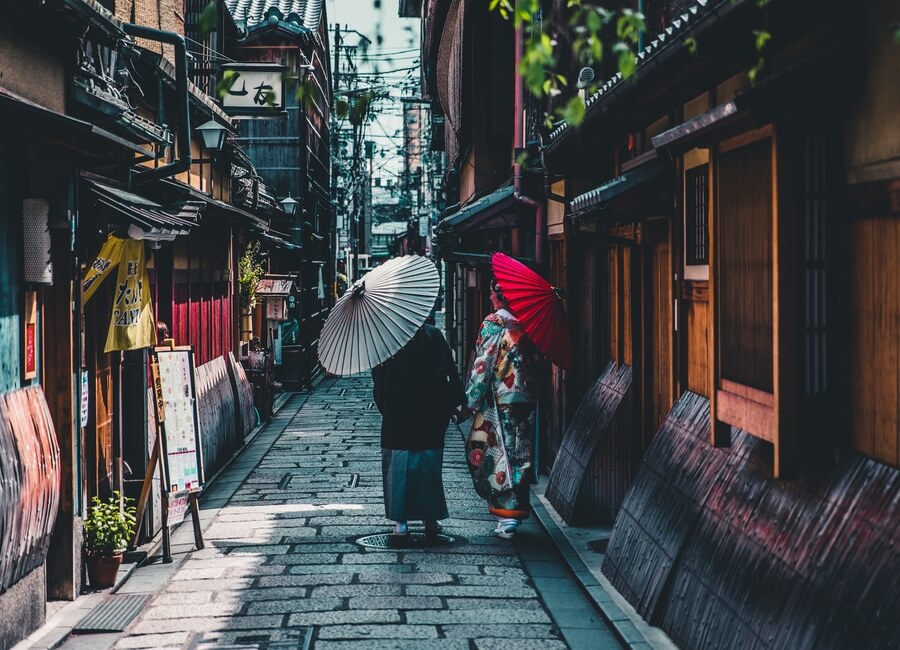 Woman Walking Down Street in Japan